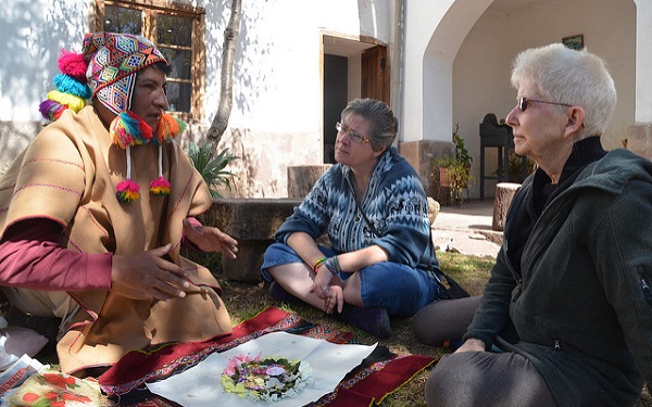 two women in Peru with shaman