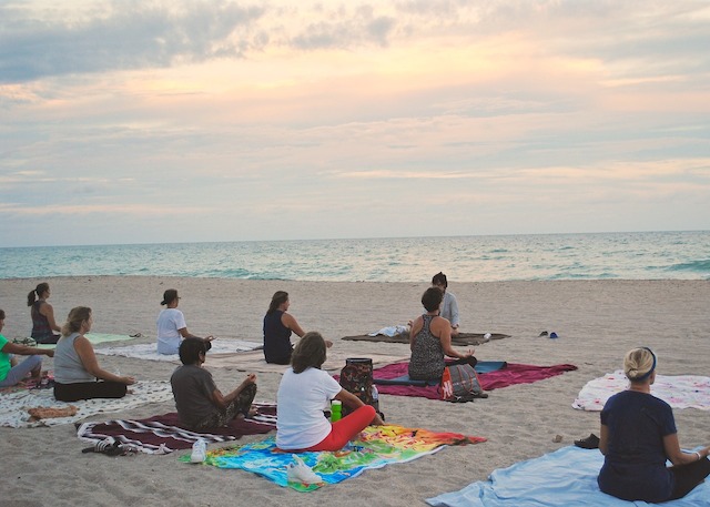 Holidays to Cuba: yoga practice on Havana's Santa María del Mar.