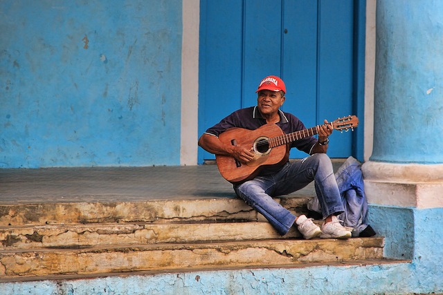 A Cuban musician plays his guitar in Havana.